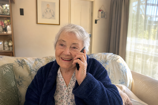 Elderly woman answering phone