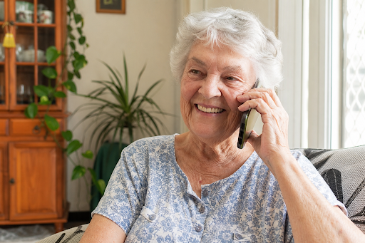 Elderly woman answering phone